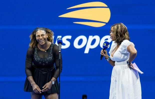 Gayle King interviews Serena Williams on the court after her victory.