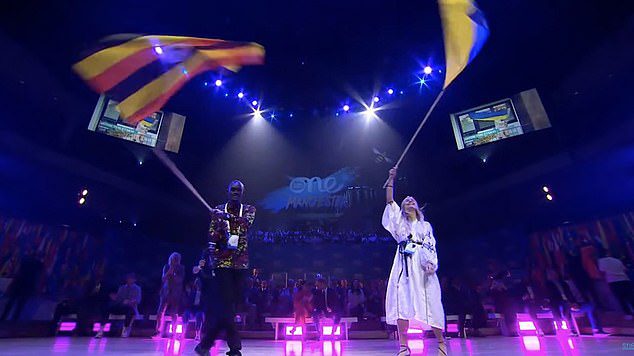 The couple's apparent excitement for the UK came after they stood at the presentation of the Ukrainian flag, likely in solidarity with the country amid the Russian invasion.