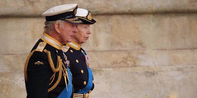 King Charles III and Anne, Princess Royal, leave Westminster Abbey after the funeral of Queen Elizabeth II on September 19, 2022 in London.