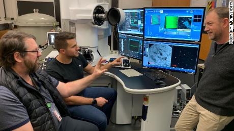 (From left) Dougal McCulloch, professor at RMIT University, with Salk and Tomkins at RMIT's Microscopy and Microanalysis Facility in Australia.  McCulloch was another co-author of the study.