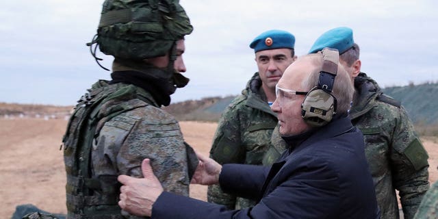 Russian President Vladimir Putin meets with soldiers during a visit to a military training center of the Western Military District to mobilize reservists outside the city of Ryazan on October 20, 2022. 