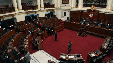 Lawmakers stand inside Congress on the day of their scheduled impeachment vote against President Pedro Castillo in Lima, Peru, Wednesday, December 7, 2022.